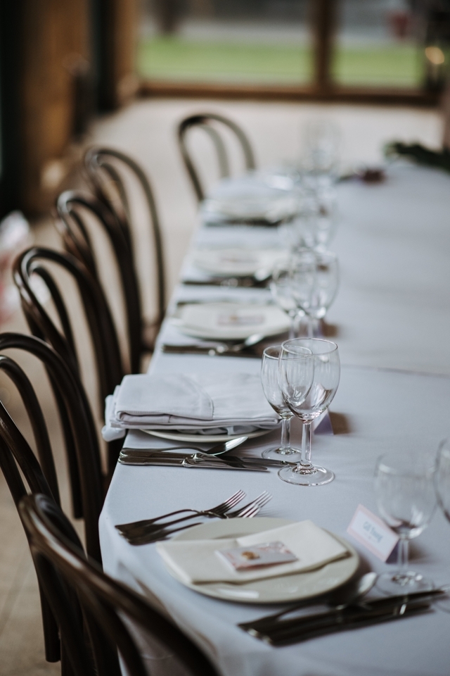 wedding-day-s-decorated-table-with-plates-napkins-wine-glasses-forks-knives